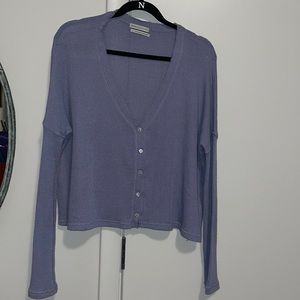 Purple button up sweater.